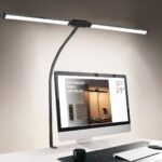 Lampe de bureau LED pratique à double tête Lampe de bureau LED pratique à double tête installée et allumée à un bureau au dessus d'un écran