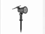 Lampe LED solaire noire style projecteur sur pied, sur un fond blanc.