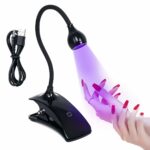 Lampe UV LED ongle flexible pour manucure Lampe UV LED flexible pour manucure qui éclaire des ongles et sur fond blanc