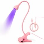 Lampe UV LED rose flexible pour ongles sur fond blanc