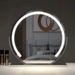 Miroir LED coiffeuse design et élégant noir posé sur une table dans une chambre