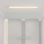 Panneau LED blanc design moderne et minimaliste Panneau LED blanc design moderne et minimaliste, dans une pièce blanche.