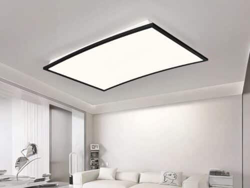 Panneaux LED design moderne et rectangulaire incurvé, de couleur noir, dans un salon.