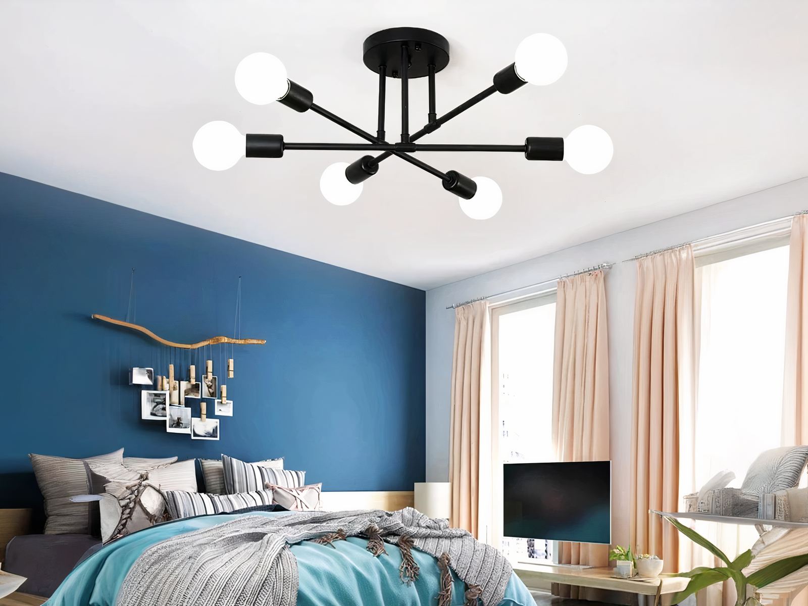 Plafonnier LED élégant au design moderne noir allumé dans une chambre