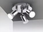 Projecteur LED argenté avec têtes rotatives installé sur un plafond gris