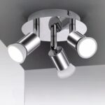 Projecteur LED argenté avec têtes rotatives installé sur un plafond gris