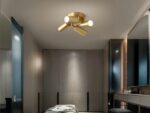 Projecteur LED doré à quatre têtes