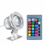 Spot LED extérieur multicolore avec télécommande Spot LED extérieur de couleur argenté sur fond blanc avec une télécommande avec des boutons multicolores.