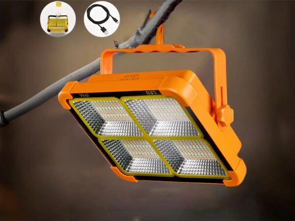 Lampe de travail LED solaire rechargeable, orange, accrochée à une branche d'arbre.