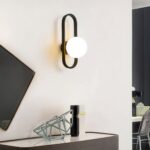 Luminaire LED mural moderne en acier durable Luminaire LED mural moderne en acier durable allumé dans un salon