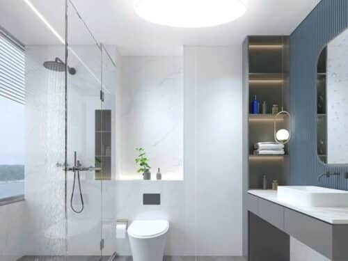 Le plafonnier LED rond ultra-mince et blanc sur le plafond d'une salle de bain.